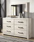 Cambeck King Upholstered Panel Bed with Mirrored Dresser and Chest