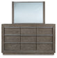 Anibecca King Upholstered Bed with Mirrored Dresser, Chest and Nightstand
